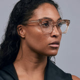 Brutal 1.0 Optical by Tribu Eyewear — Champagne Crystal square optical frame, female model studio lighting.