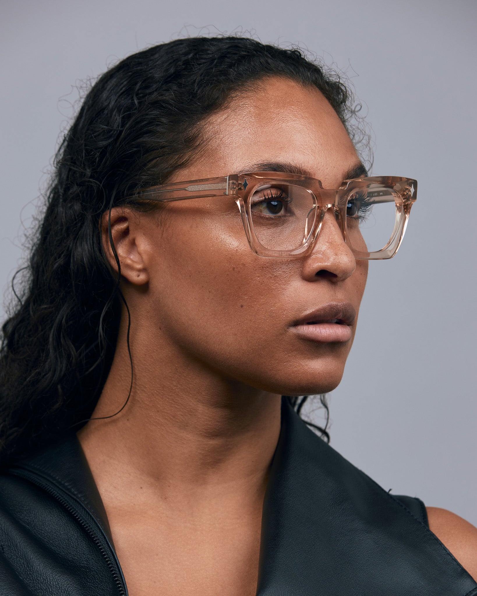 Brutal 1.0 Optical by Tribu Eyewear — Champagne Crystal square optical frame, female model studio lighting.