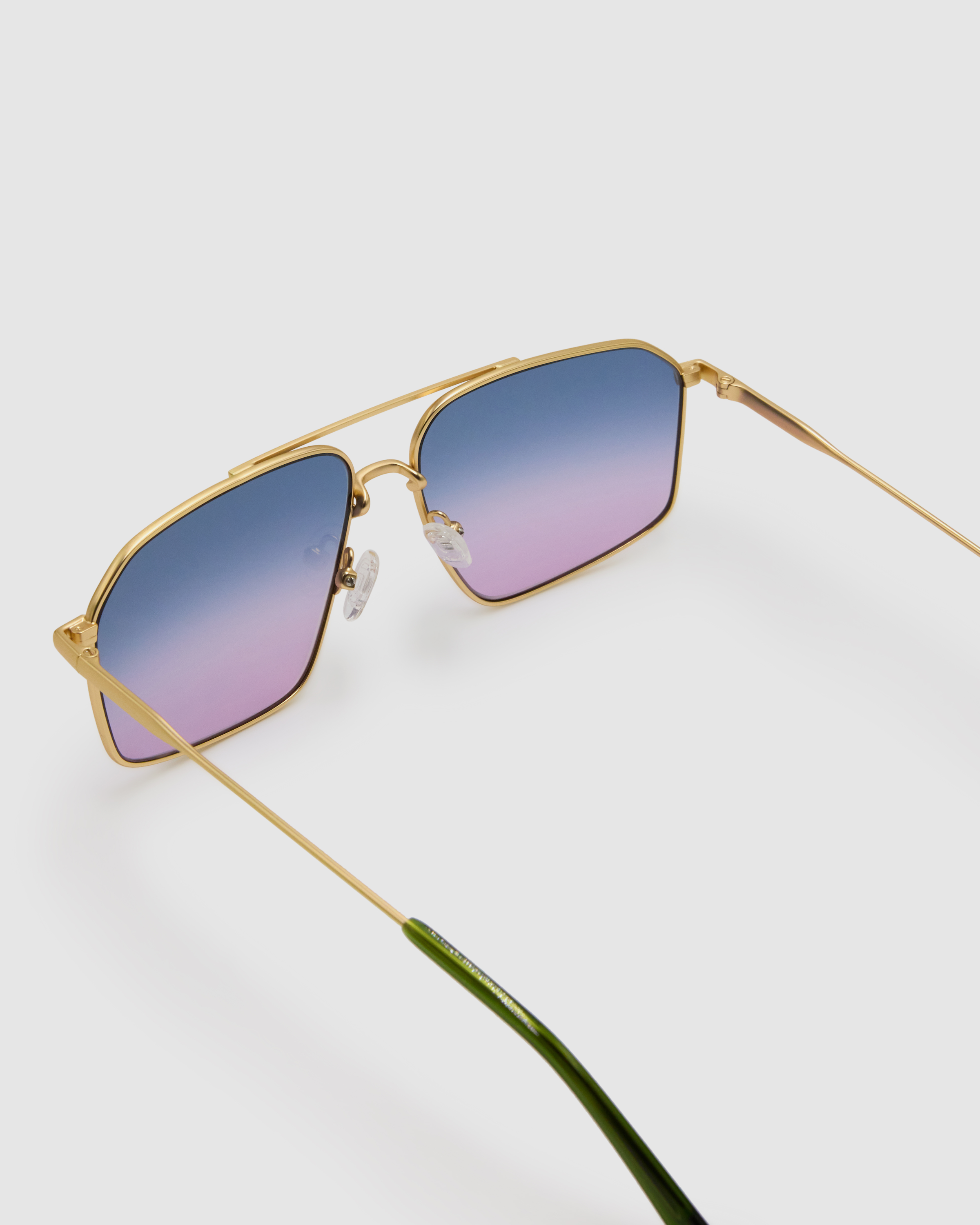 FONDA Brushed Gold Sunglasses by Tribu Eyewear — Deep Ocean, detail view.