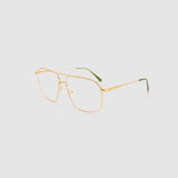 Fonda Brushed Gold Optical by Tribu Eyewear — Fine wire metal frame, side view studio lighting.