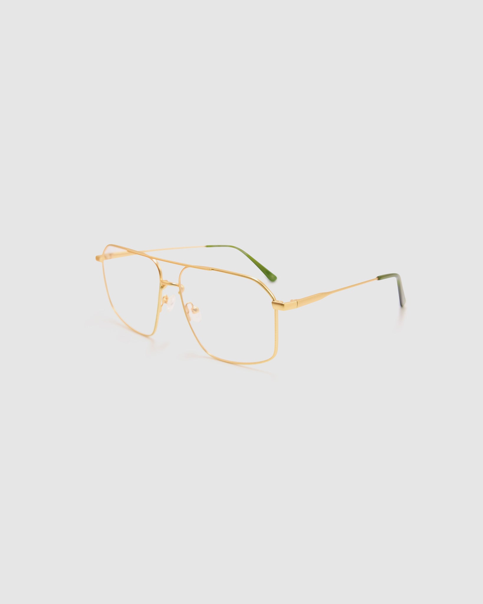 Fonda Brushed Gold Optical by Tribu Eyewear — Fine wire metal frame, side view studio lighting.