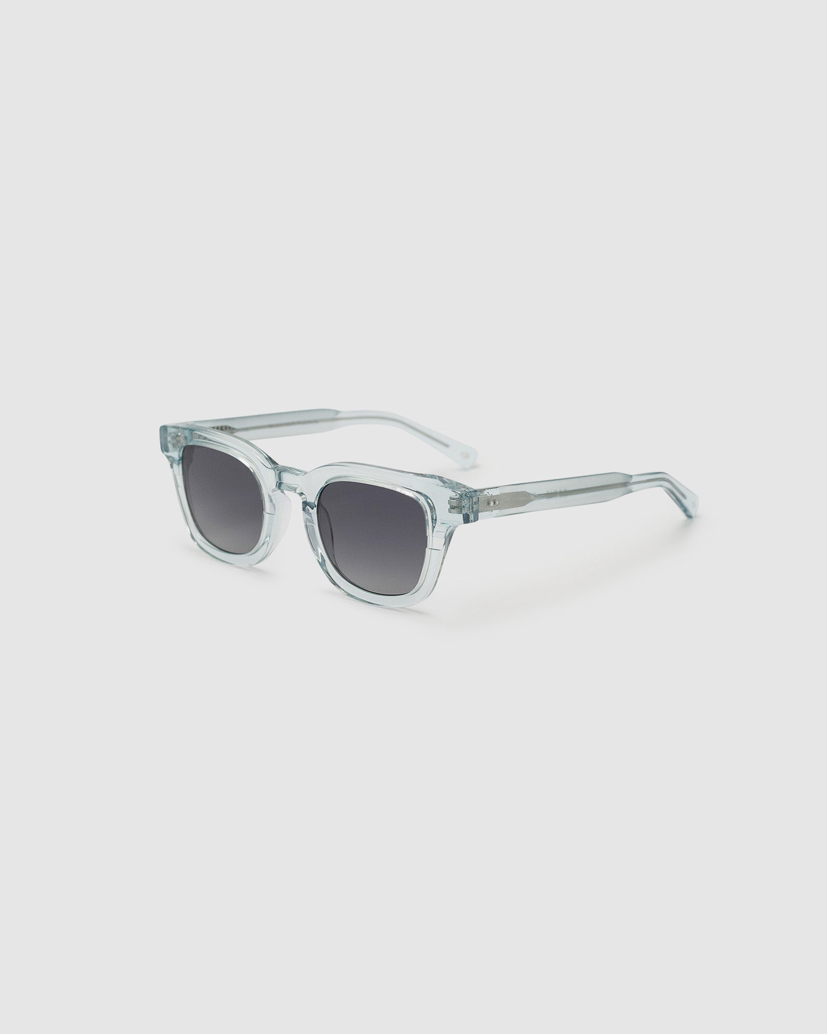Bowie polarised sunglasses by TRIBU Eyewear in baby blue crystal acetate, side view on light grey background.