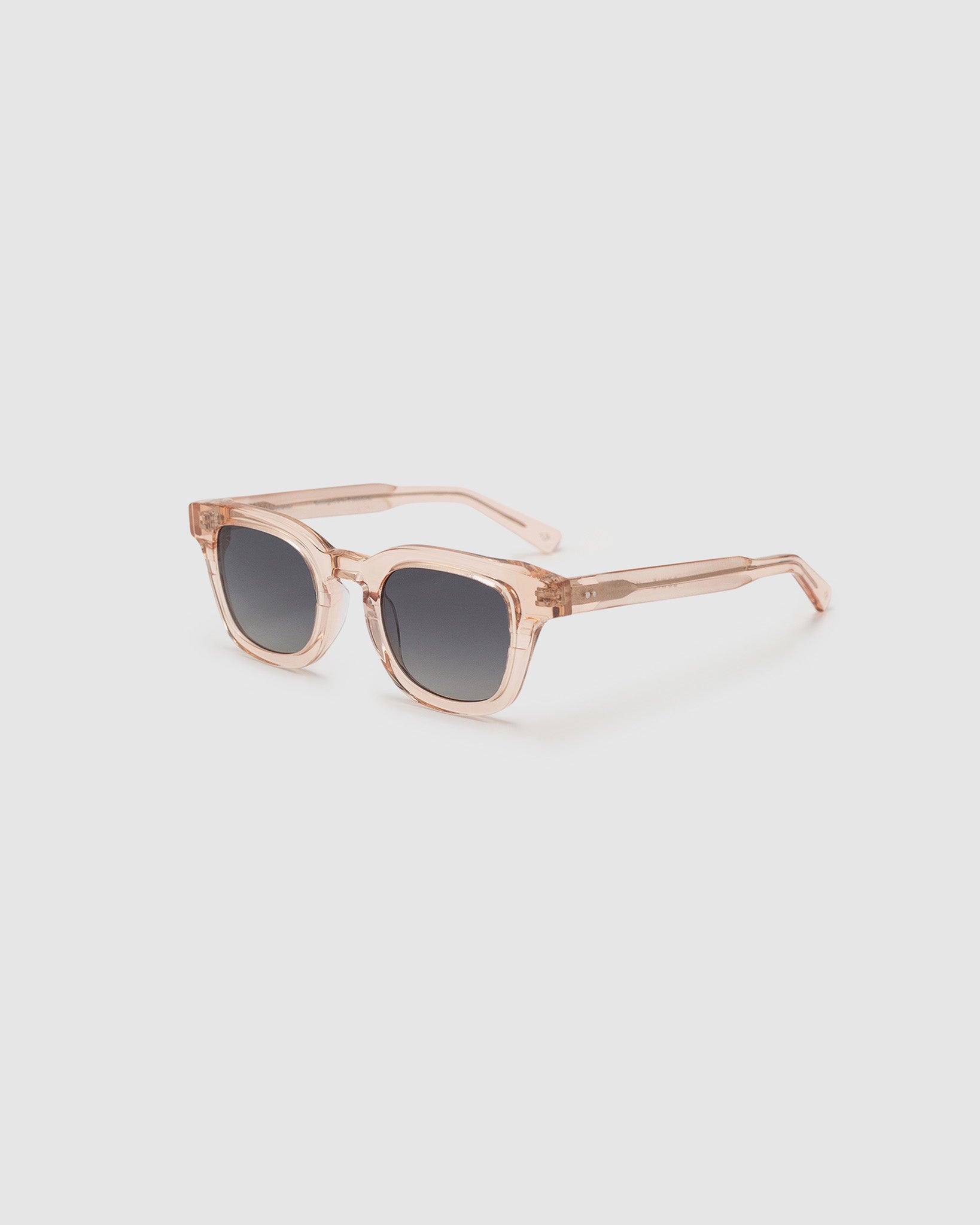 Bowie polarised sunglasses by TRIBU Eyewear champagne crystal acetate, side view on light grey background.