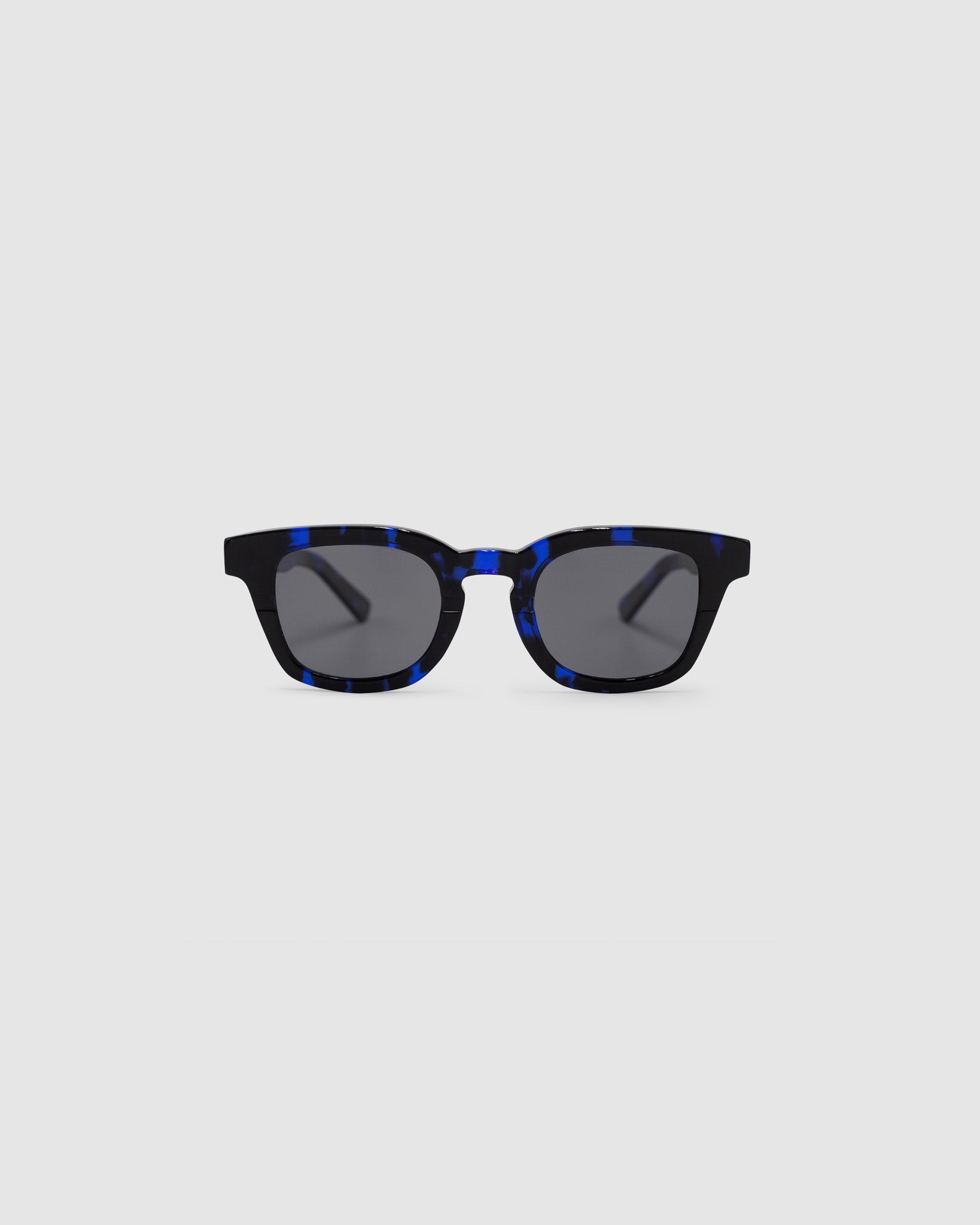 Bowie Polarised Sunglasses by Tribu Eyewear — Electro Blue Puddle classic acetate frame, front view light grey background.