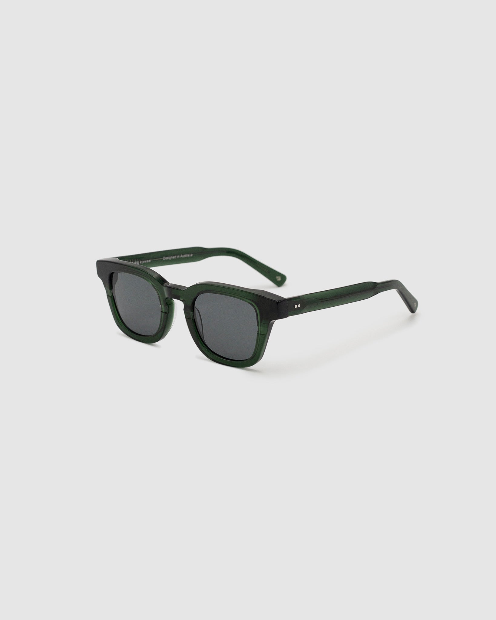 Bowie Polarised Sunglasses by Tribu Eyewear — Forest Green classic acetate frame, side view light grey background.