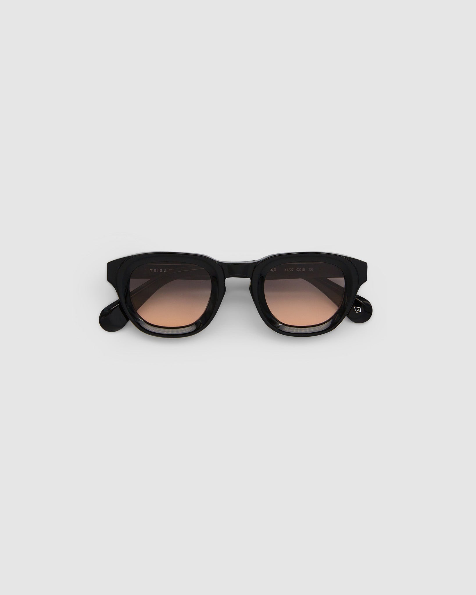 Brutal 4.0 Sunglasses by Tribu Eyewear — Black round acetate frame, dusk lens, flat view light grey background.