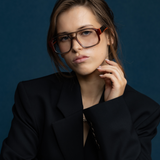 The DON Optical by Tribu Eyewear — Burgundy on Smoke Aviator frame, model wearing front view studio lighting. 