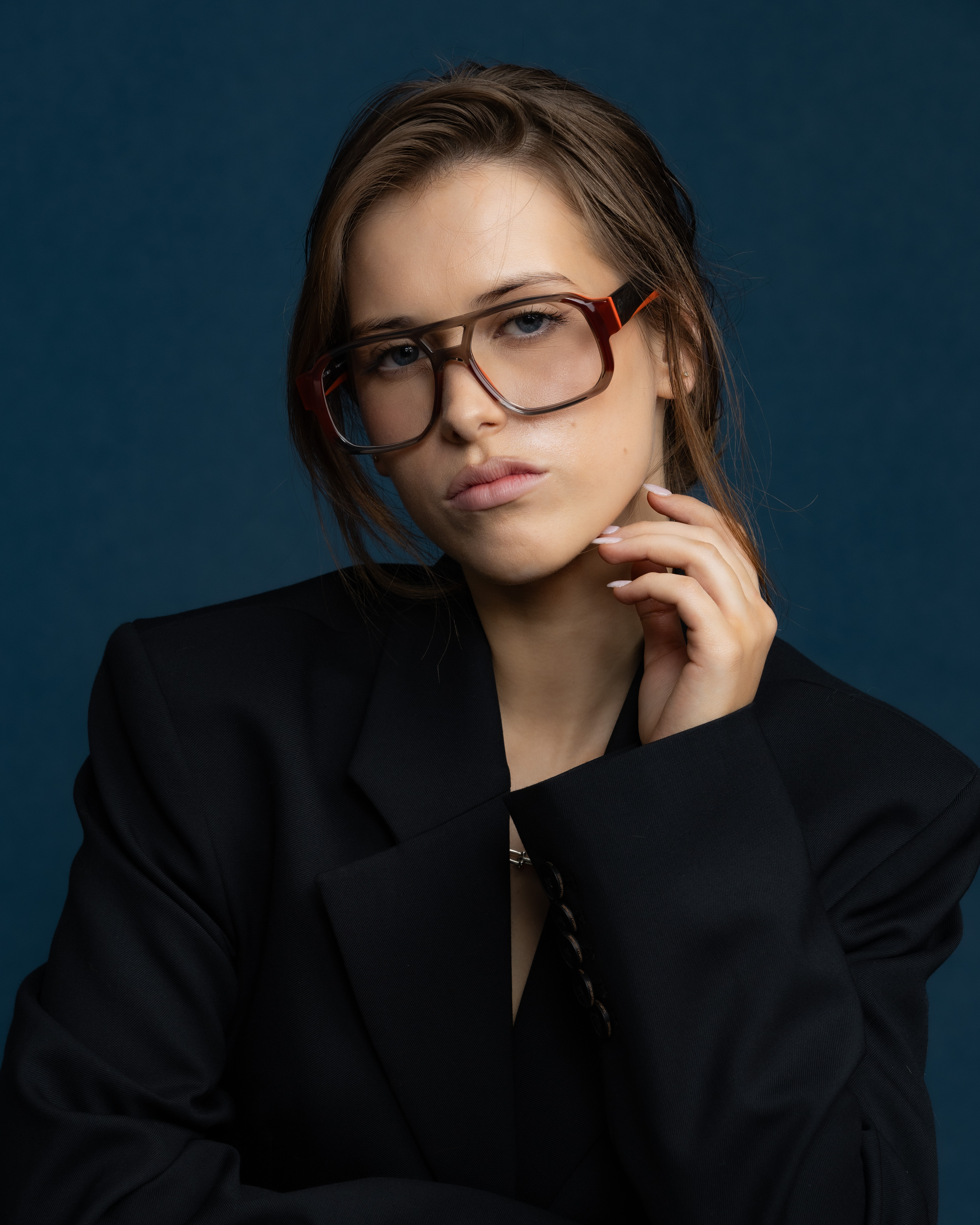 The DON Optical by Tribu Eyewear — Burgundy on Smoke Aviator frame, model wearing front view studio lighting. 