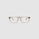 Gentleman Optical by Tribu Eyewear — champagne crystal rectangular optical frame, front view on a grey background. 