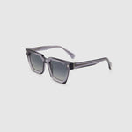 Brutal 1.0 Polarised Sunglasses by Tribu Eyewear — Smoke rectangular acetate frame, grey grad lens, side view light grey background.