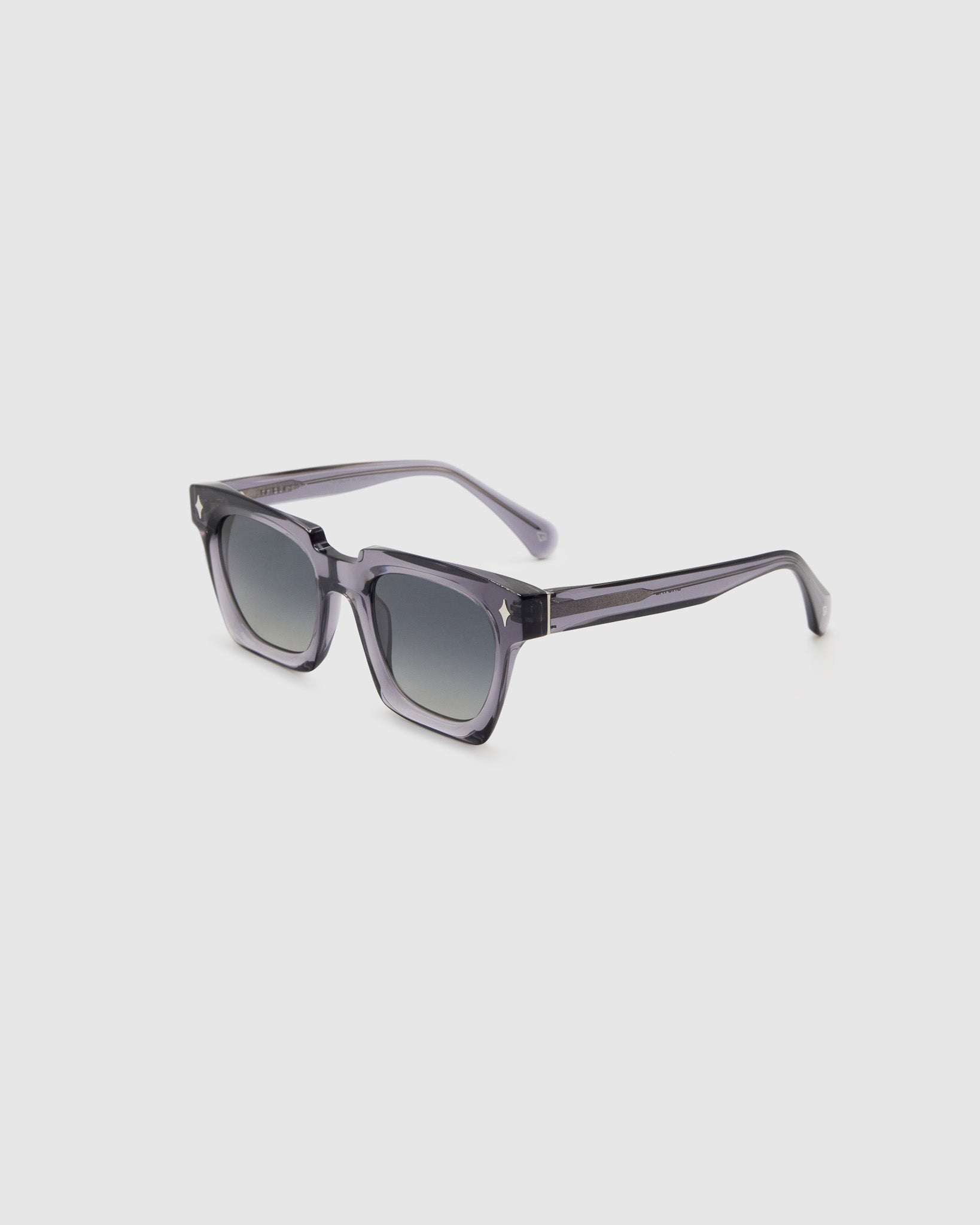Brutal 1.0 Polarised Sunglasses by Tribu Eyewear — Smoke rectangular acetate frame, grey grad lens, side view light grey background.