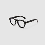 Brutal 2.0 Optical by Tribu Eyewear — Black round optical frame, side view studio lighting. 