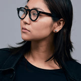 Brutal 2.0 Optical by Tribu Eyewear — Tortoiseshell round optical frame, female model studio lighting. 