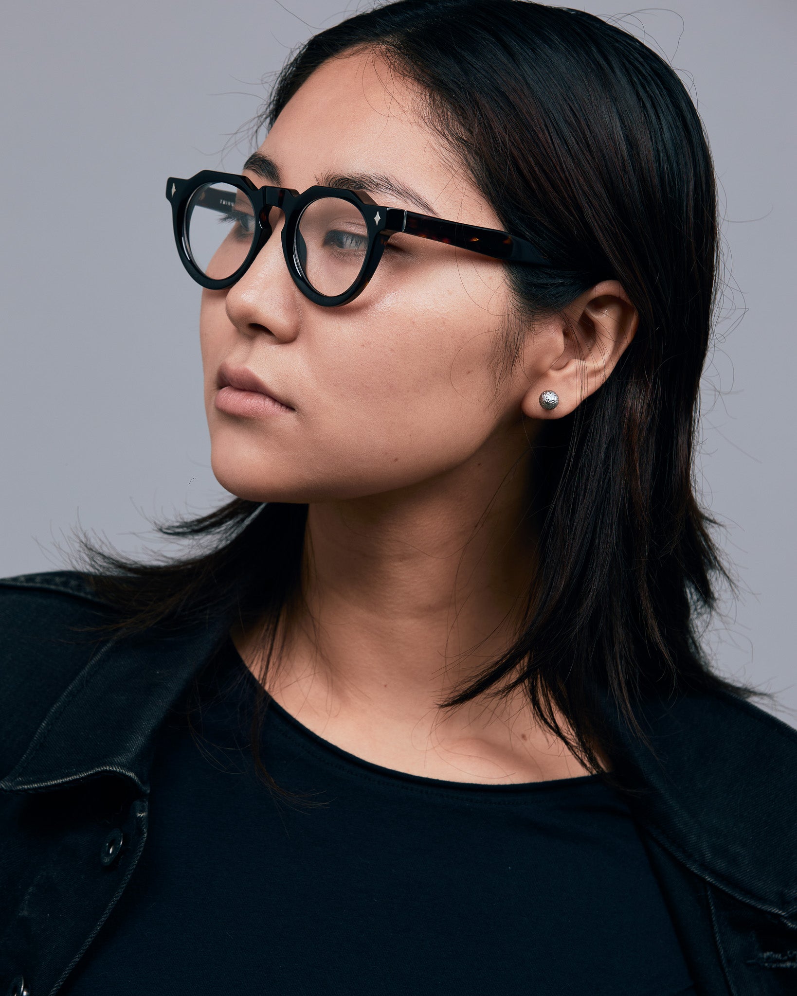 Brutal 2.0 Optical by Tribu Eyewear — Tortoiseshell round optical frame, female model studio lighting. 