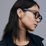 Brutal 2.0 Optical by Tribu Eyewear — Tortoiseshell round optical frame, female model side view studio lighting. 