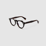 Brutal 2.0 Optical by Tribu Eyewear — Tortoiseshell round optical frame, side view studio lighting. 
