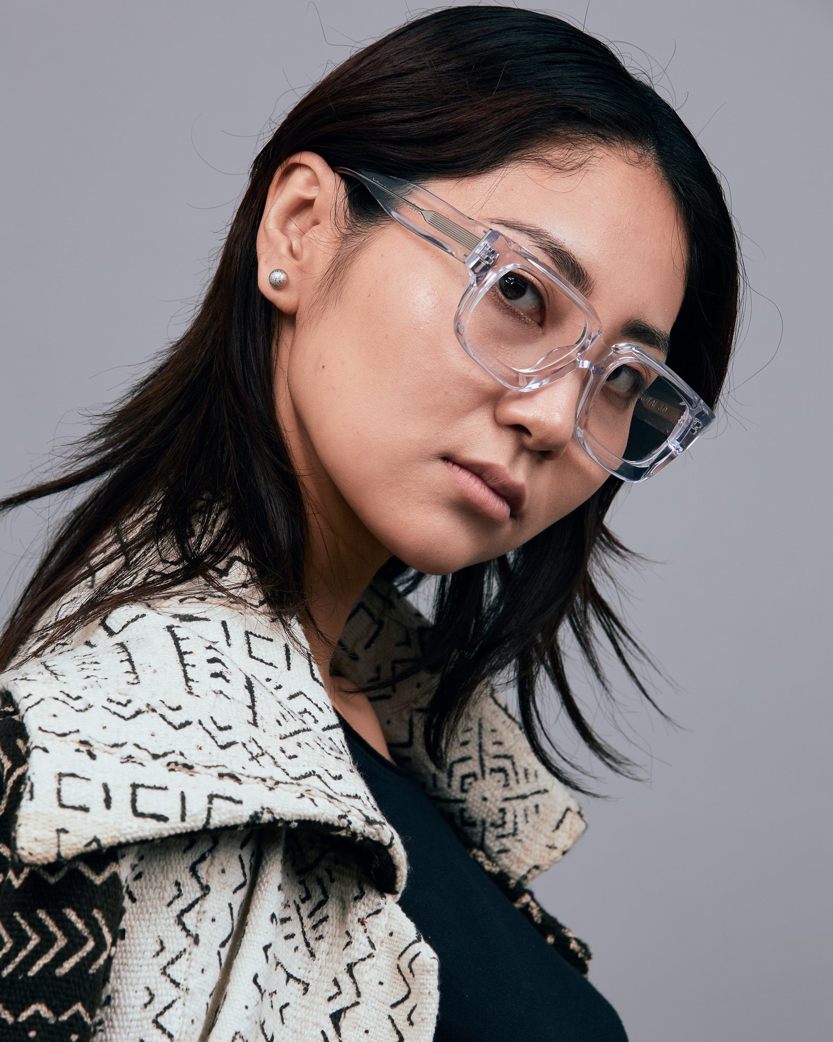 Brutal 3.0 Optical by Tribu Eyewear — Crystal Square optical frame, female model studio lighting. 