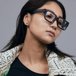Brutal 3.0 Optical by Tribu Eyewear — Smoke Crystal square optical frame, female model studio lighting. 