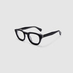 Brutal 4.0 Optical by Tribu Eyewear — Black on Crystal round optical frame, side view studio lighting. 