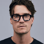 Brutal 4.0 Optical by Tribu Eyewear — Black round optical frame, male model  studio lighting. 