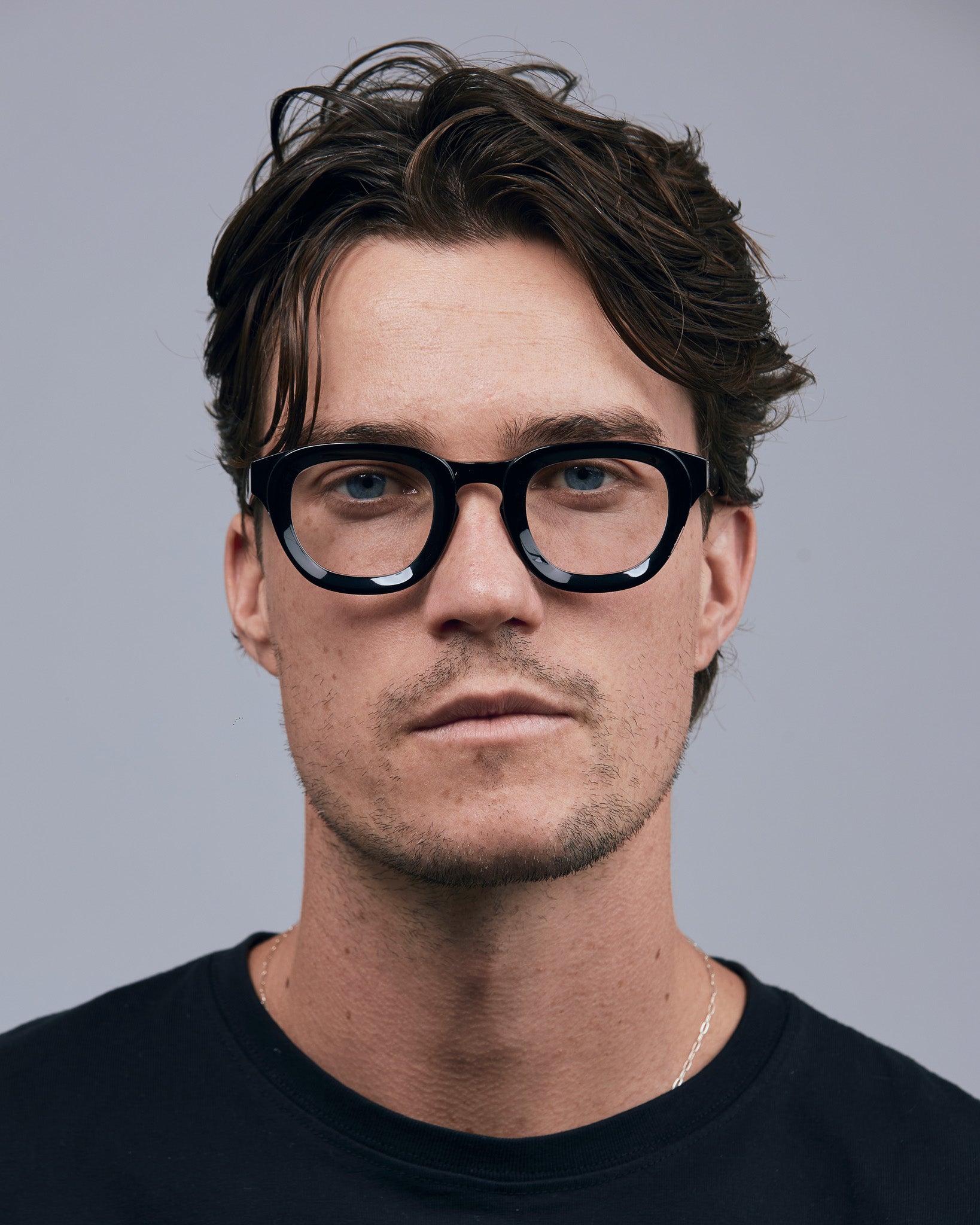 Brutal 4.0 Optical by Tribu Eyewear — Black round optical frame, male model  studio lighting. 