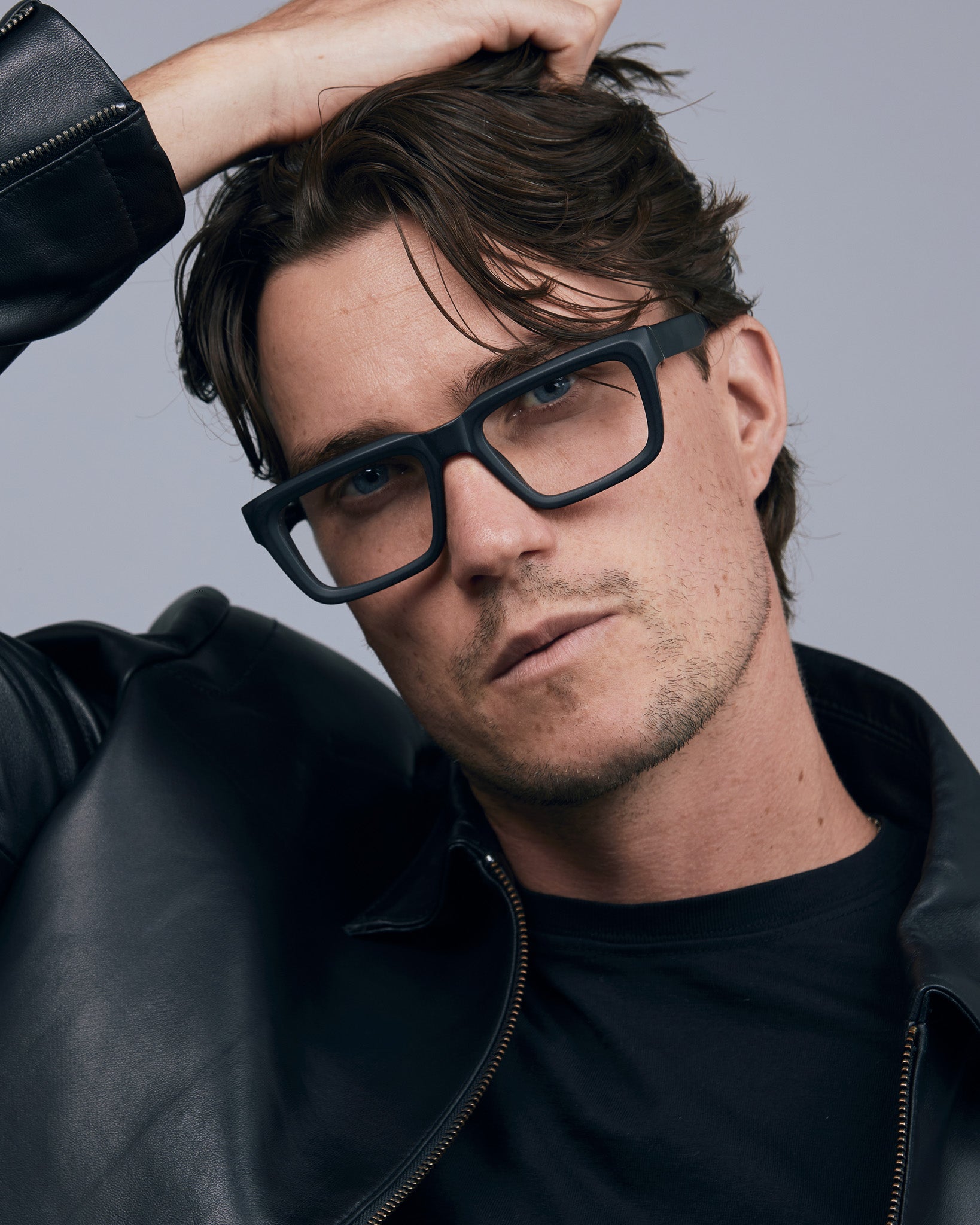 Brutal 5.0 Optical by Tribu Eyewear — Matte Black square optical frame, male model. 