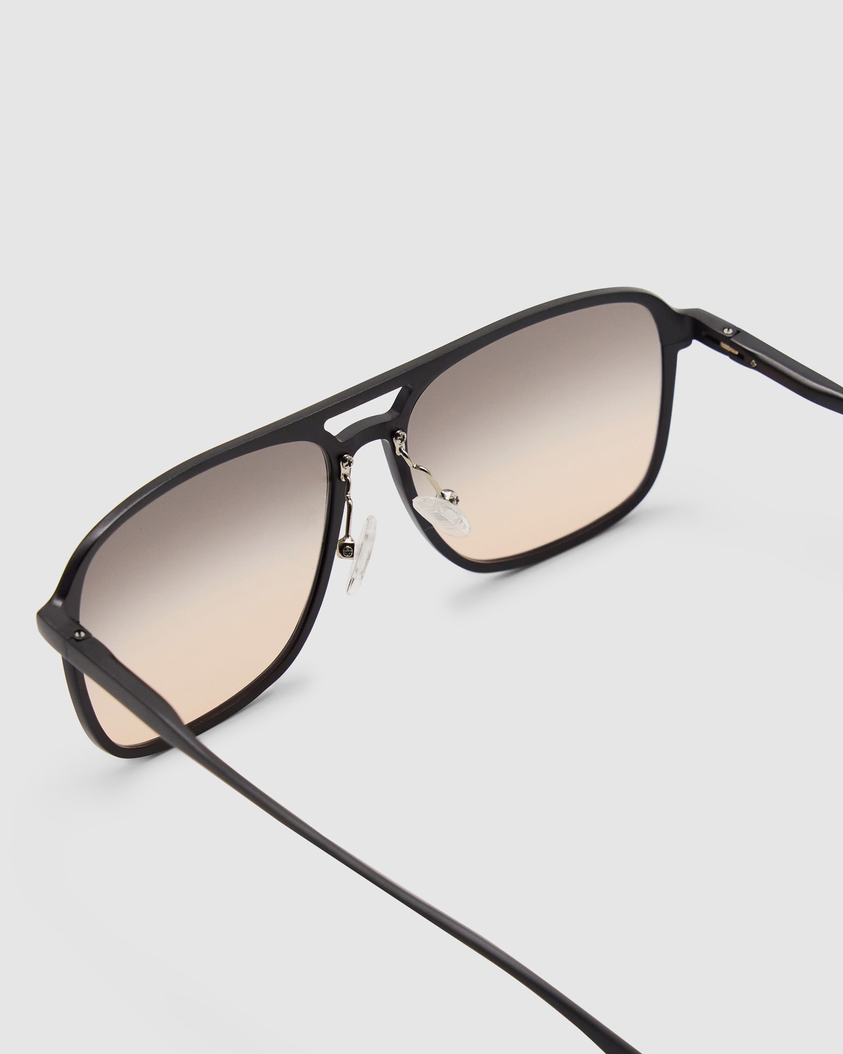 Oscar Sunglasses by Tribu Eyewear — Black Aluminium Aviator frame, Dusk lens detailed view.