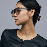 Oscar Sunglasses by Tribu Eyewear — Black Aluminium Aviator frame, Dusk lens female model.