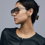 Oscar Sunglasses by Tribu Eyewear — Black Aluminium Aviator frame, Dusk lens female model.