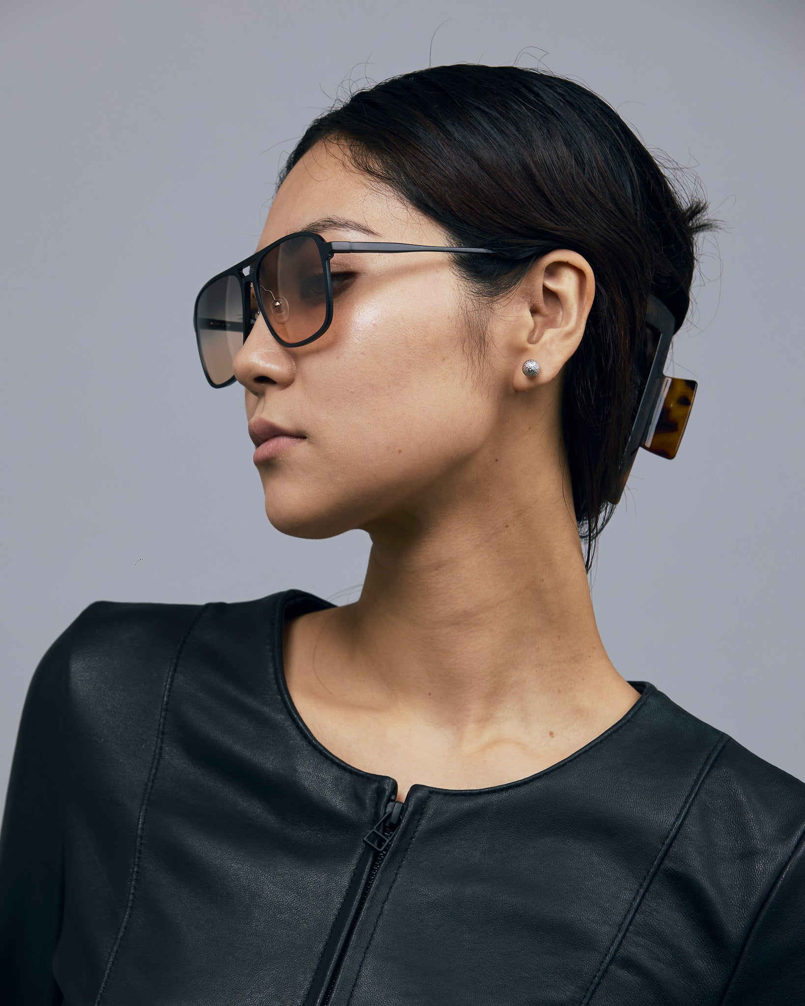 Oscar Sunglasses by Tribu Eyewear — Black Aluminium Aviator frame, Dusk lens female model.