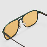 Oscar Sunglasses by Tribu Eyewear — Forest Green Aluminium Aviator frame, Desert Orange lens, detailed view against white background.