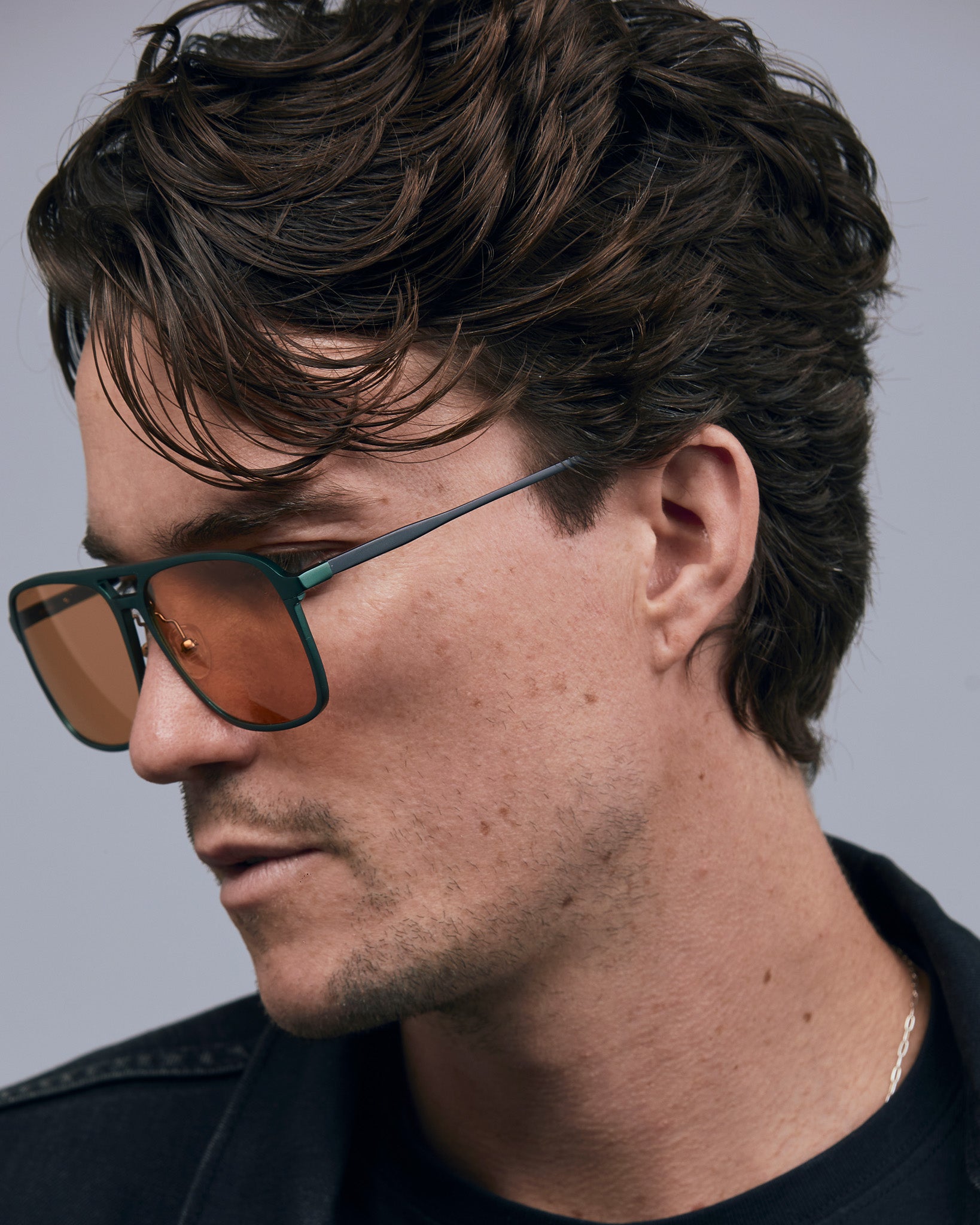 Oscar Sunglasses by Tribu Eyewear — Forest Green Aluminium Aviator frame, Desert Orange lens male model, white background