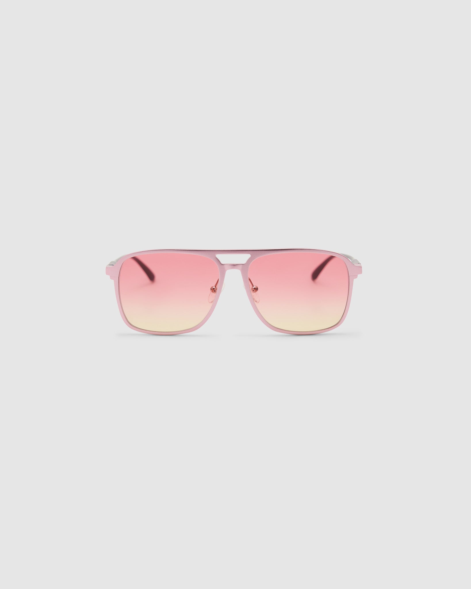 Oscar Sunglasses by Tribu Eyewear — Metallic Pink Aluminium Aviator frame, Sunset lens front view against a white background.