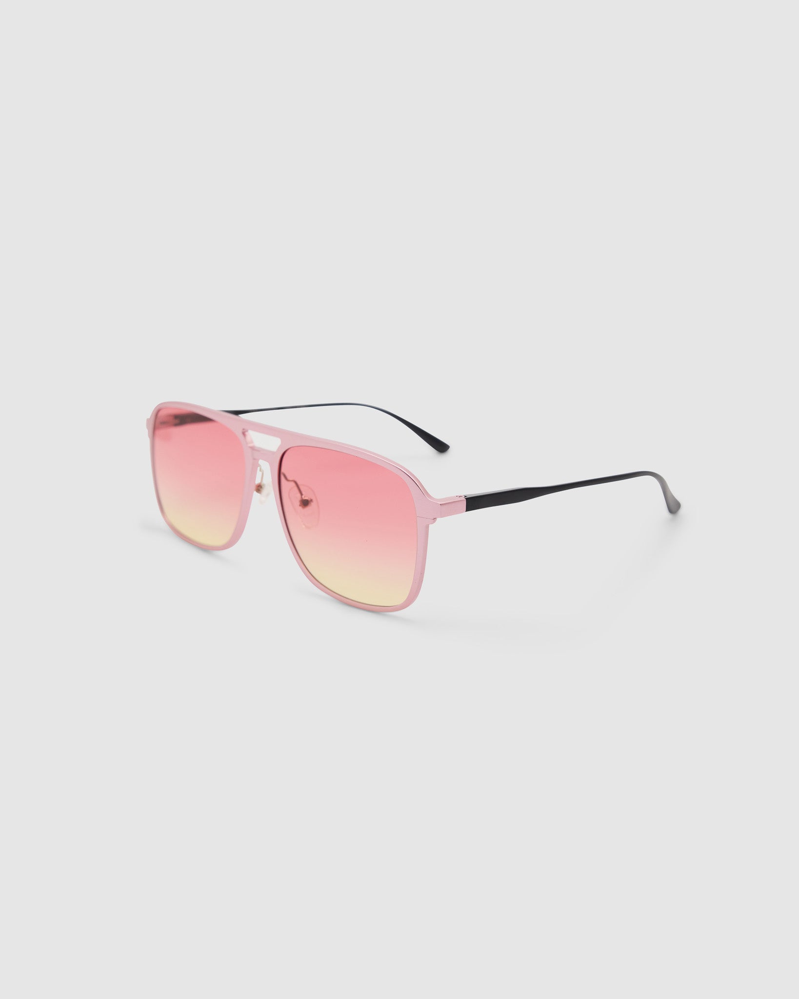 Oscar Sunglasses by Tribu Eyewear — Metallic Pink Aluminium Aviator frame, Sunset lens side view against a white background.