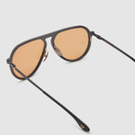 TRIBU Carbon 2.0 Black carbon fibre sunglasses with desert orange lenses, detailed view.