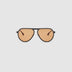 TRIBU Carbon 1.0 Black carbon fibre sunglasses with desert orange lenses, front view.