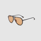 TRIBU Carbon 1.0 Black carbon fibre sunglasses with desert orange lenses, side view.