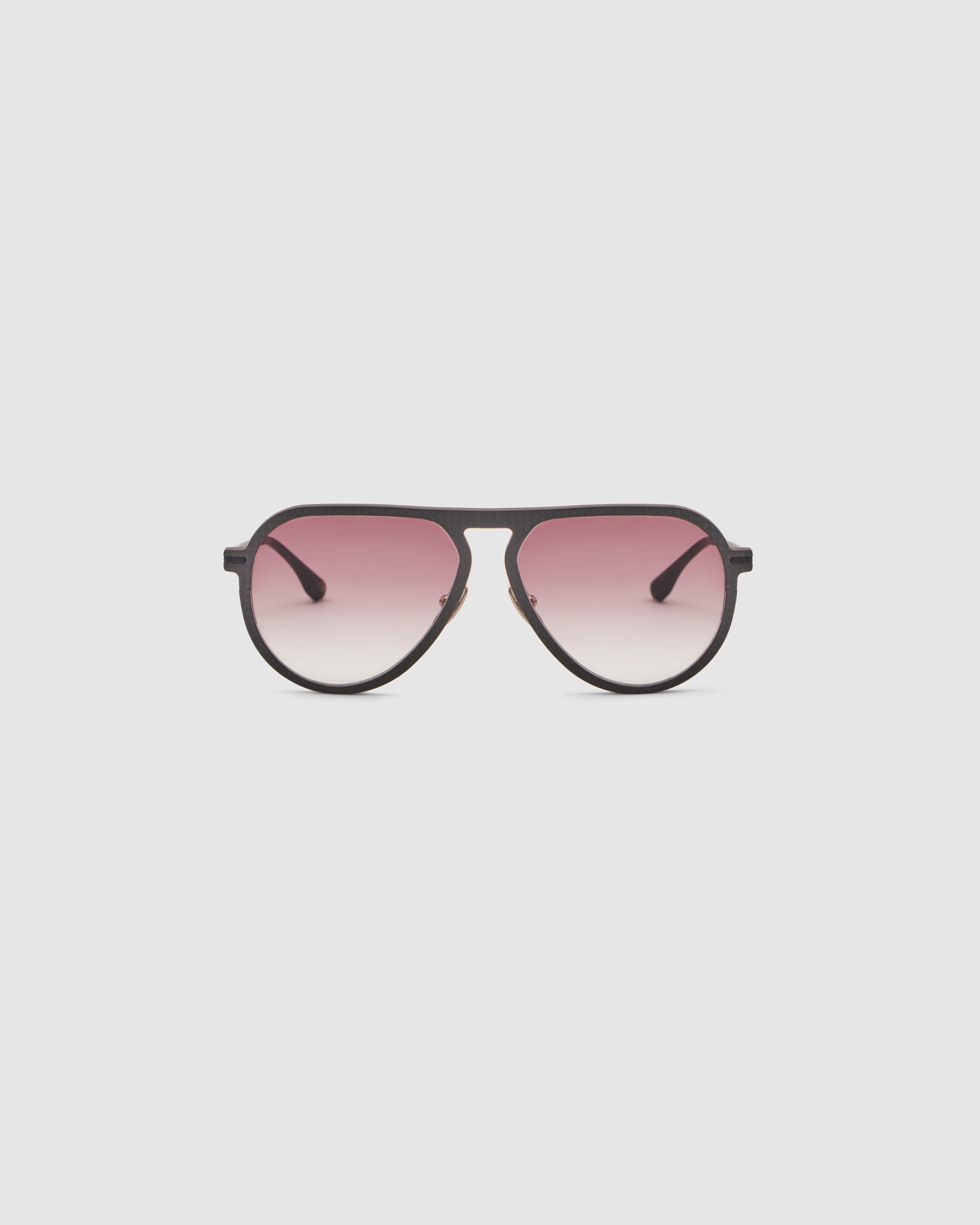 TRIBU Carbon 1.0 Black carbon fibre sunglasses with dark rose gradient lenses, front view.