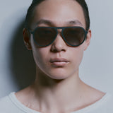Model wearing TRIBU Carbon 1.0 black carbon aviator sunglasses - Front view 