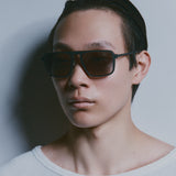 Model wearing TRIBU Carbon 2.0 gun carbon fibre square aviator sunglasses - side view 