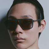 Model wearing TRIBU Carbon 2.0 gun carbon fibre square aviator sunglasses - side view 
