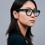 Billie Optical by Tribu Eyewear — Matte Black Aviator optical frame, female model studio lighting. 