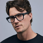 Billie Optical by Tribu Eyewear — Matte Black Aviator optical frame, male model studio lighting. 