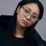 Bowie Optical by Tribu Eyewear — Baby Blue Crystal optical frame, female model studio lighting. 