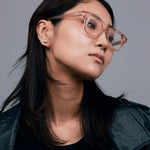Bowie Optical by Tribu Eyewear — Champagne Crystal optical frame, female model studio lighting. 