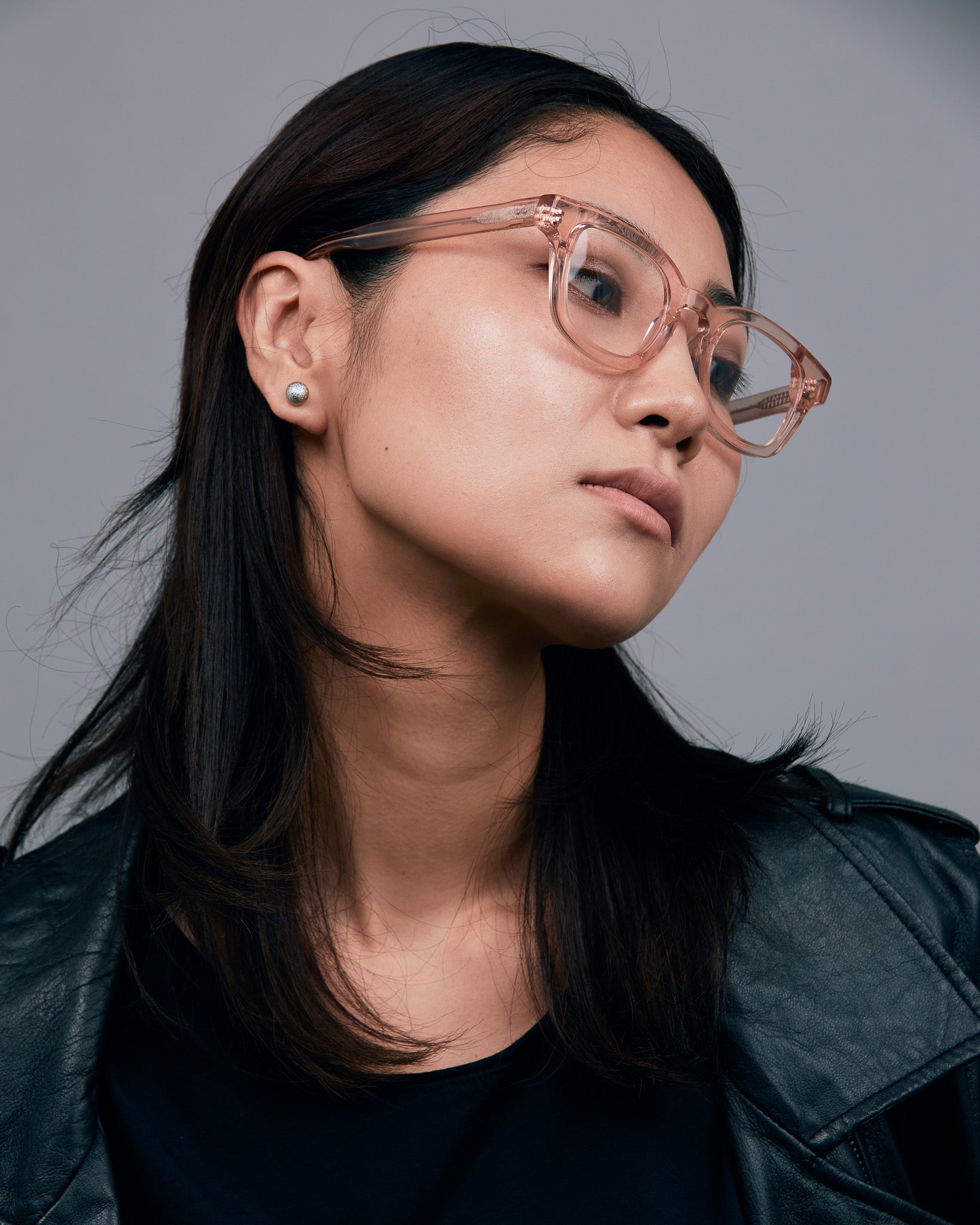 Bowie Optical by Tribu Eyewear — Champagne Crystal optical frame, female model studio lighting. 