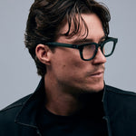 Bowie Optical by Tribu Eyewear — Forest Green optical frame, male model studio lighting. 