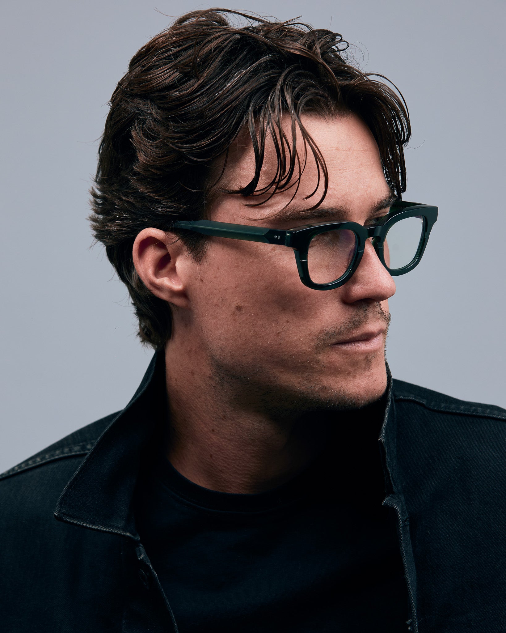 Bowie Optical by Tribu Eyewear — Forest Green optical frame, male model studio lighting. 
