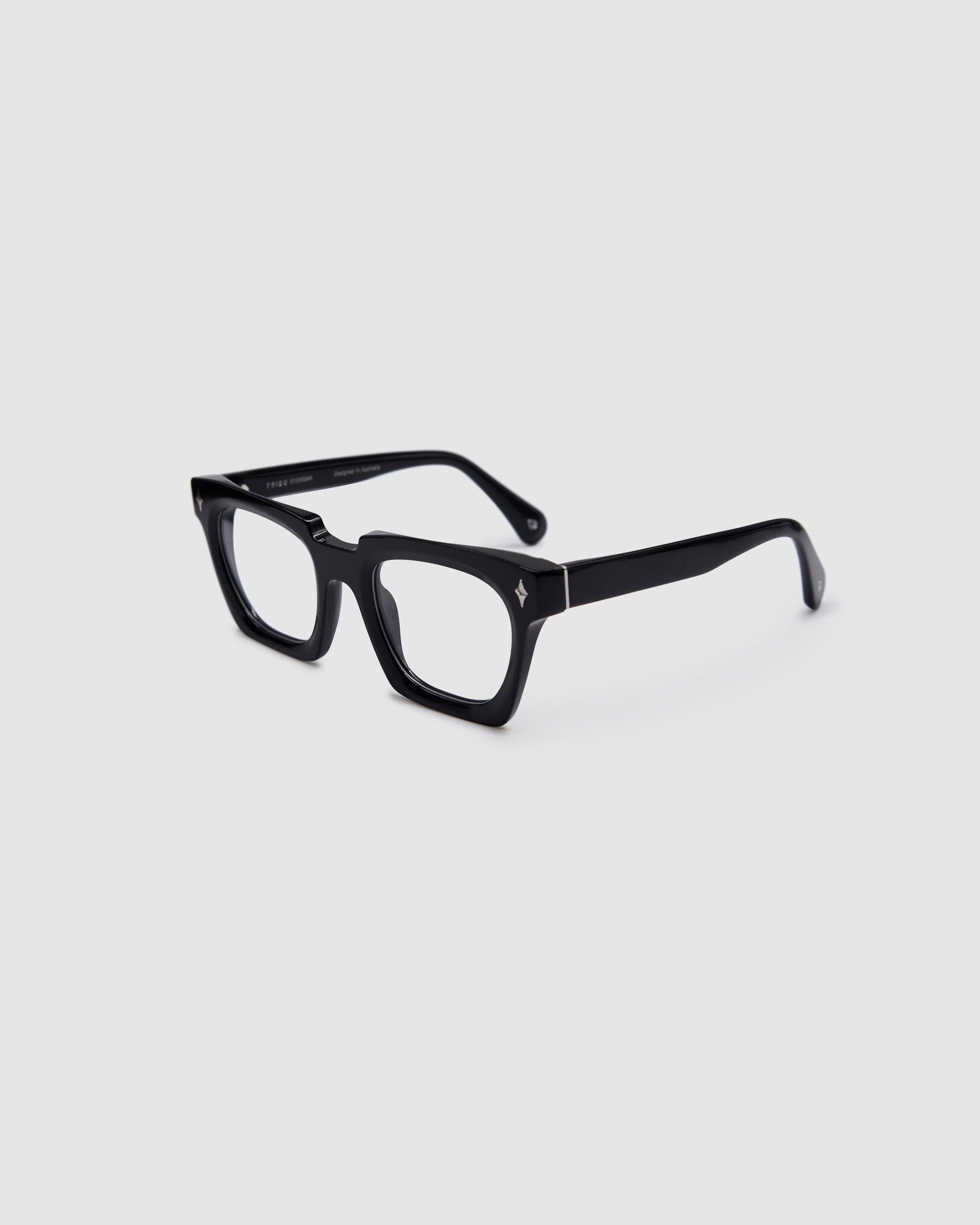 Brutal 1.0 Optical by Tribu Eyewear — Black square optical frame, side view studio lighting. 
