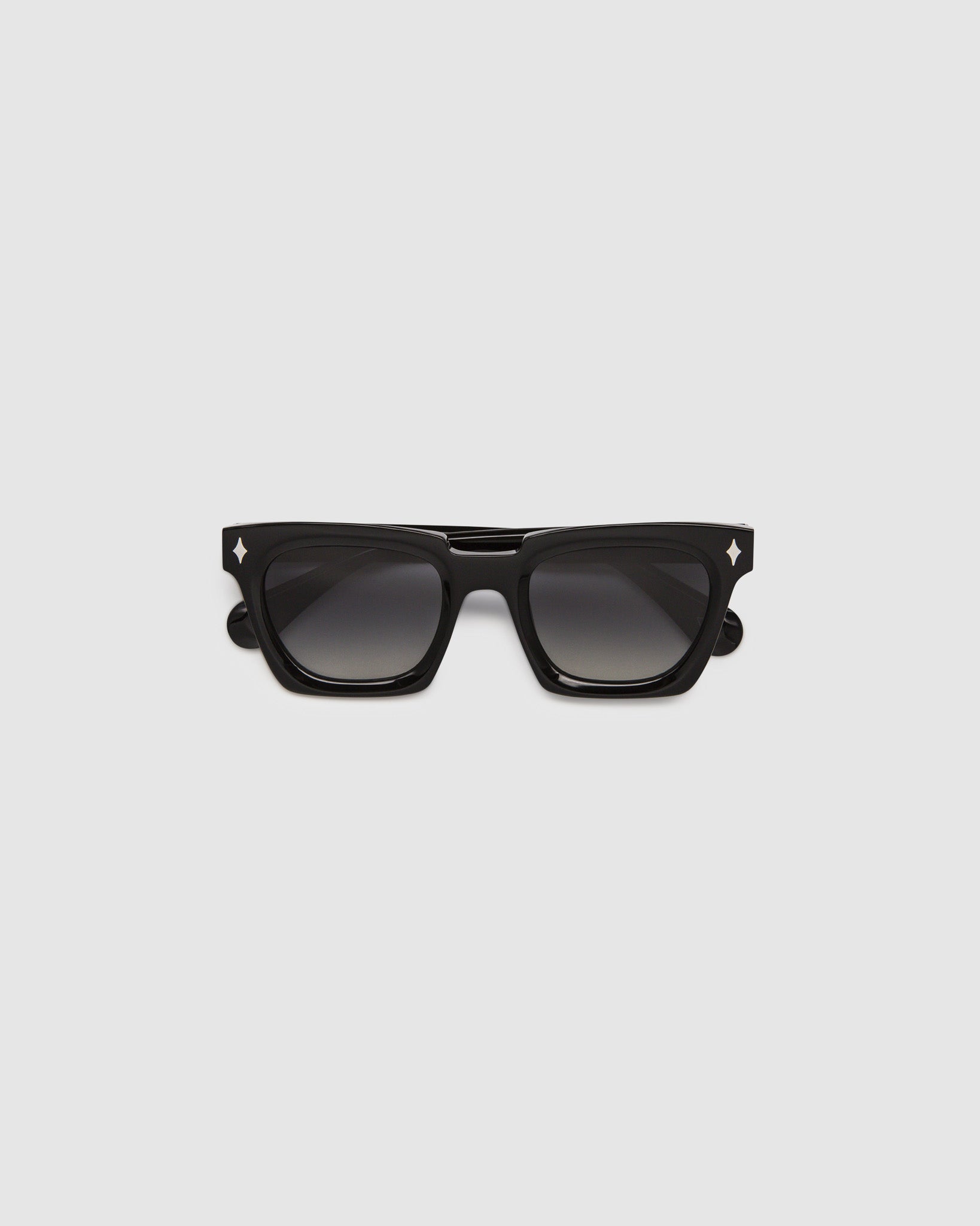 Brutal 1.0 Sunglasses by Tribu Eyewear — Black acetate square frame, grey gradient polarised flat view on grey background.